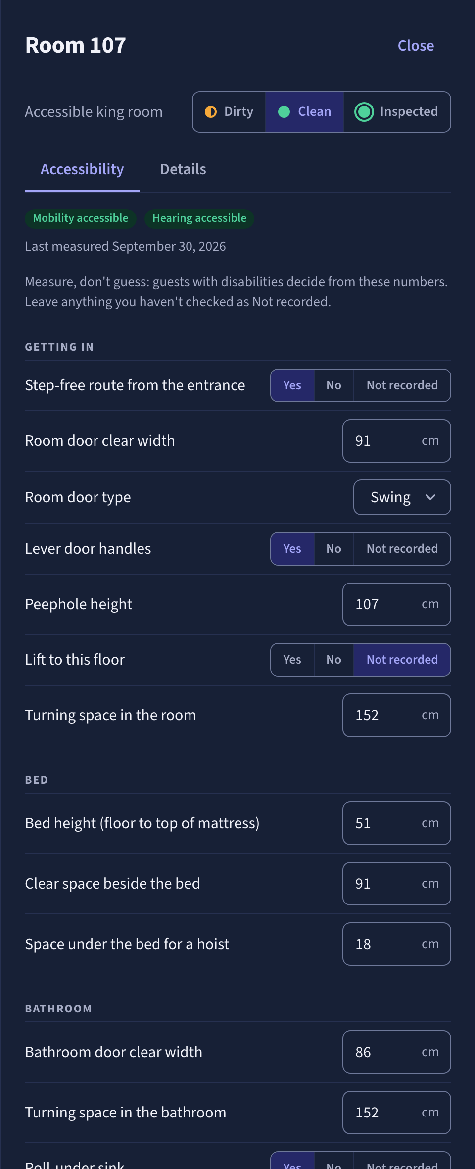 Room 107 in the staff app, Accessibility tab: step-free route from the entrance, room door clear width 91 cm, lever handles, turning space 152 cm, bed height 51 cm, clear space beside the bed 91 cm, bathroom door 86 cm.
