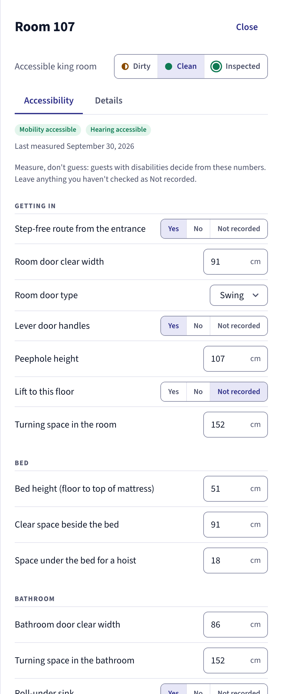 Room 107 in the staff app, Accessibility tab: step-free route from the entrance, room door clear width 91 cm, lever handles, turning space 152 cm, bed height 51 cm, clear space beside the bed 91 cm, bathroom door 86 cm.